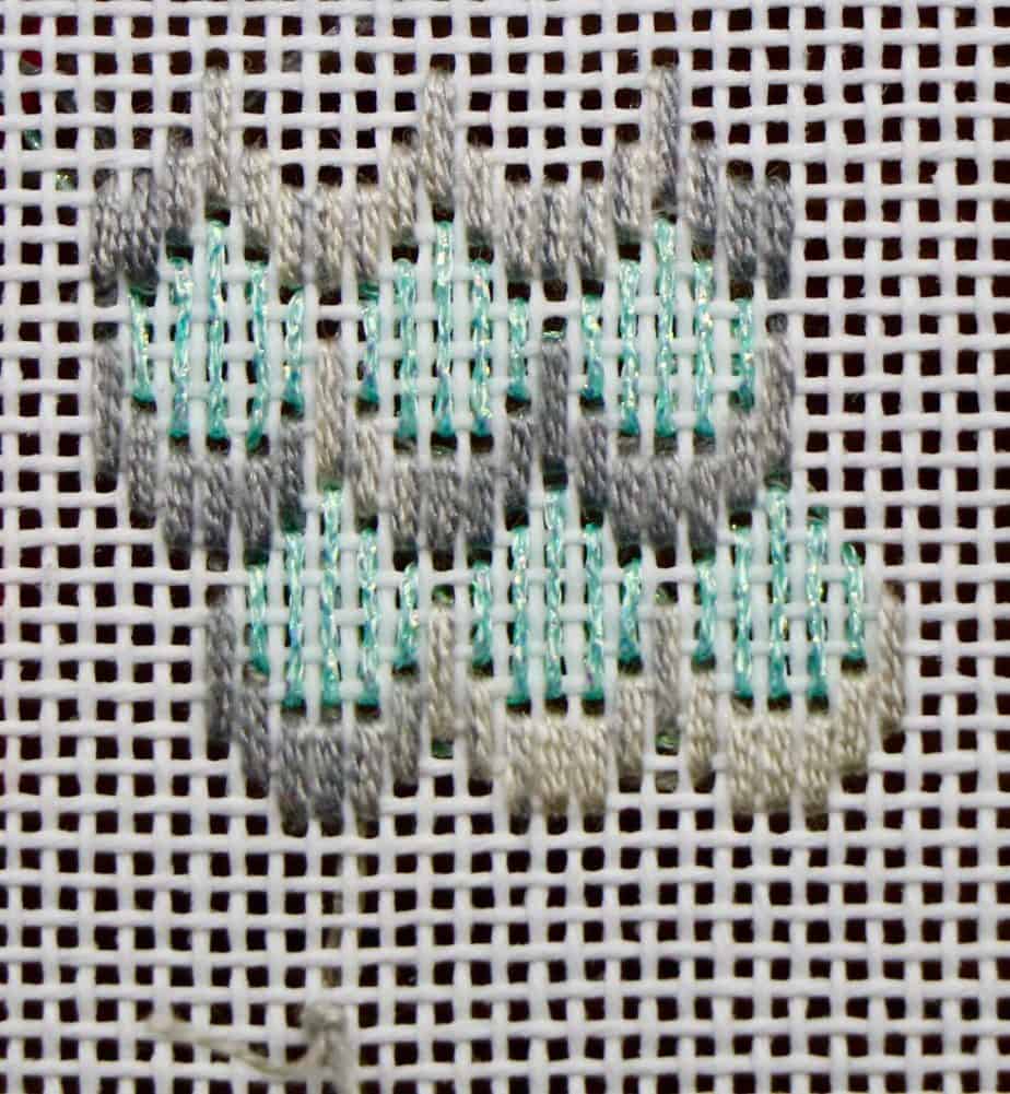 Stitched sample of a small scallop.